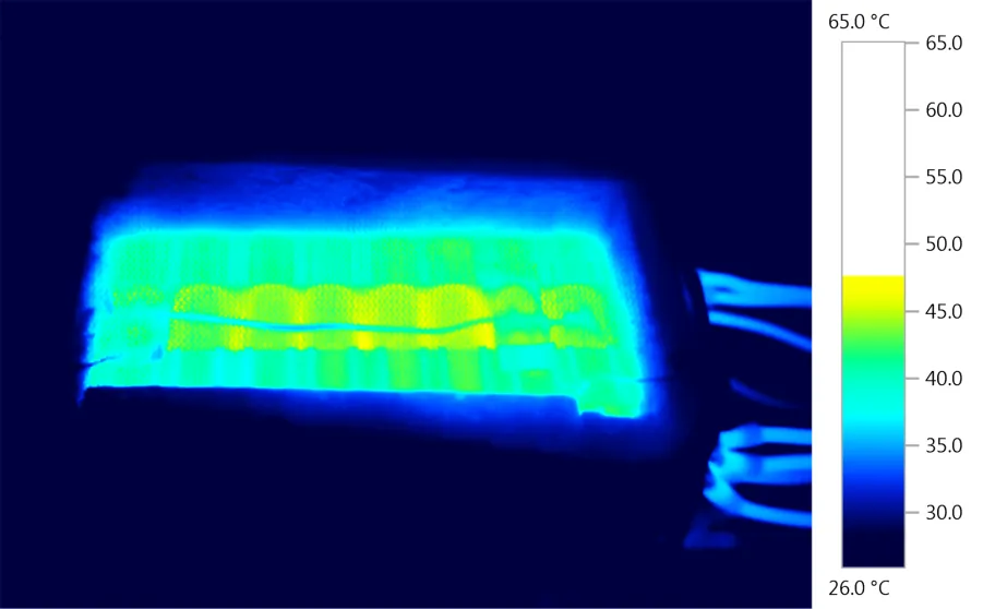 False-colour thermal image of a battery module under test, scaled from 26 to 65 degrees Celsius.